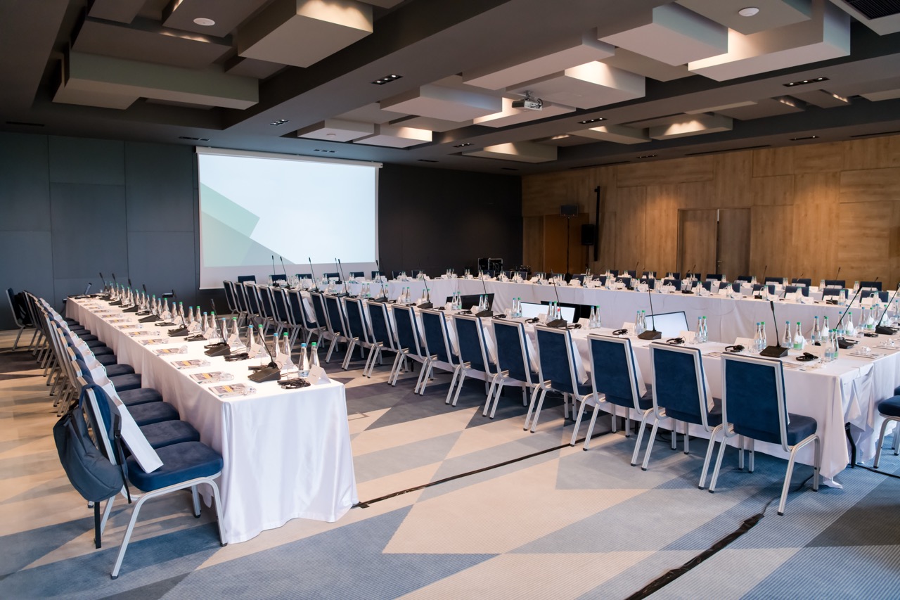 Projector and screen setup in a modern conference room in Singapore